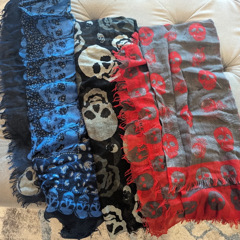 Three thin skull print scarves.